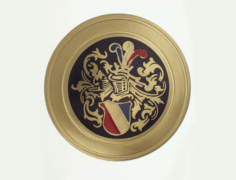 goldener couleur Bandknopf mit schwarzem Wappen
